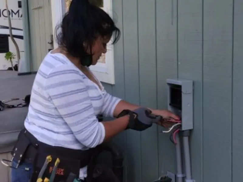 Licensed electrician wiring an exterior subpanel in Doney Park